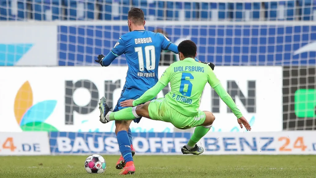 Players from Wolfsburg and Hoffenheim in action during the DFB Pokal match at Volkswagen Arena.