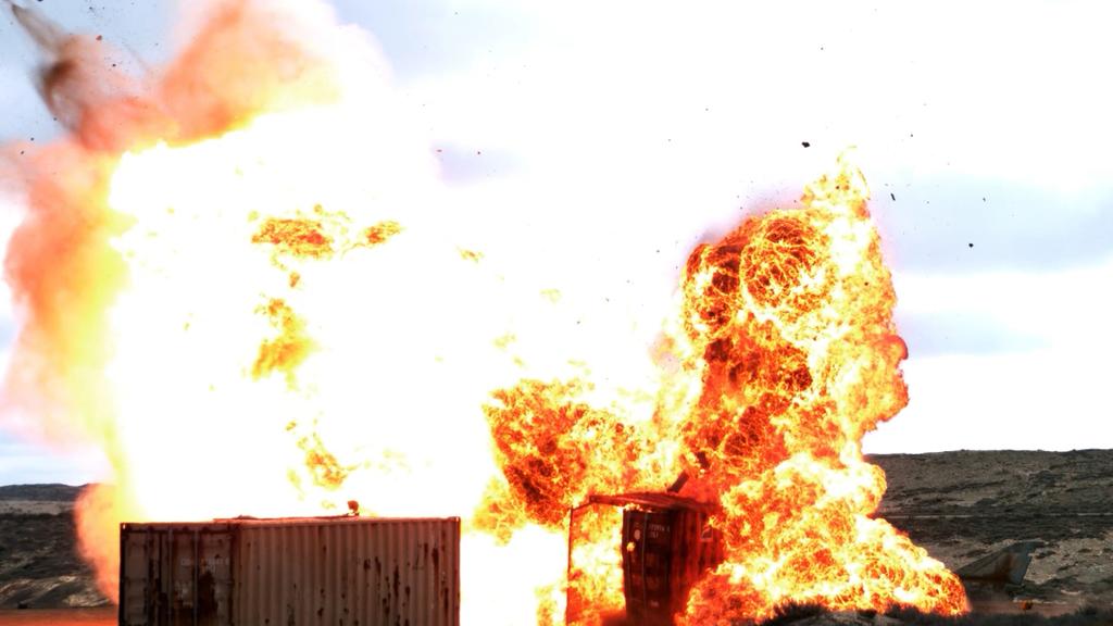 SikhoAI Moment of Impact Tomahawk Missile Strikes Shipping Container During Test Fire. Image