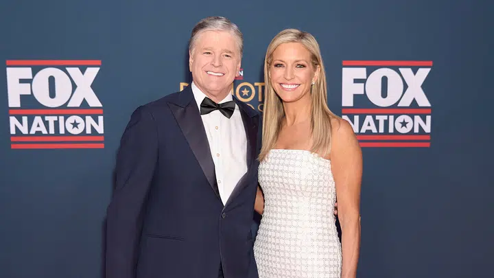 SikhoAI Sean Hannity and Ainsley Earhardt, hosts of Fox News Channel, smiling together, celebrating their engagement.