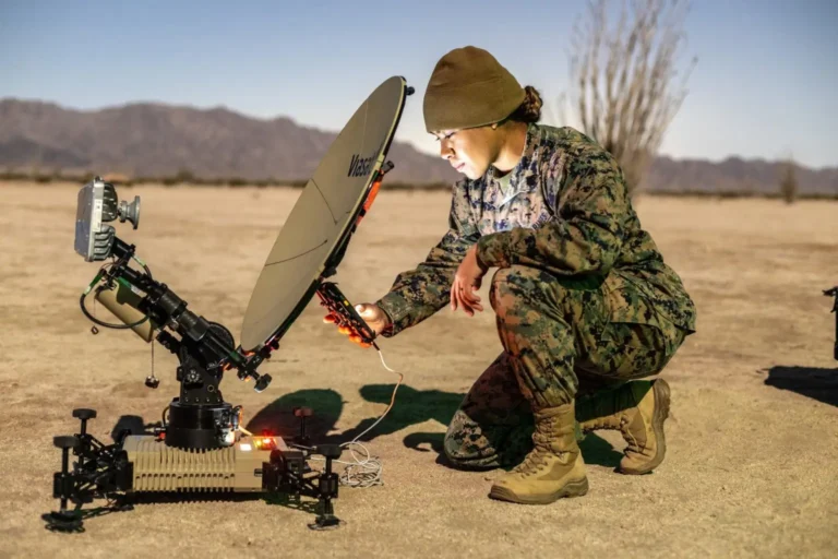A satellite communications operator from the U.S. Marine Corps establishes a multi-mission terminal during the Marine Littoral Regiment