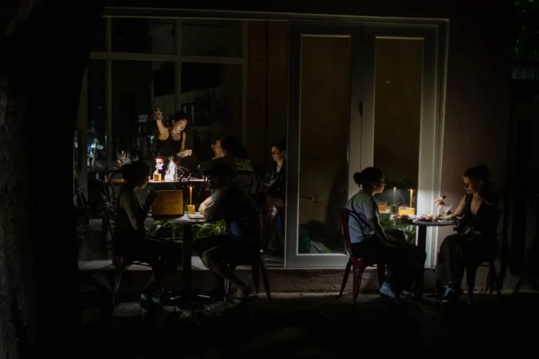 Customers dine during an island-wide power outage in San Juan
