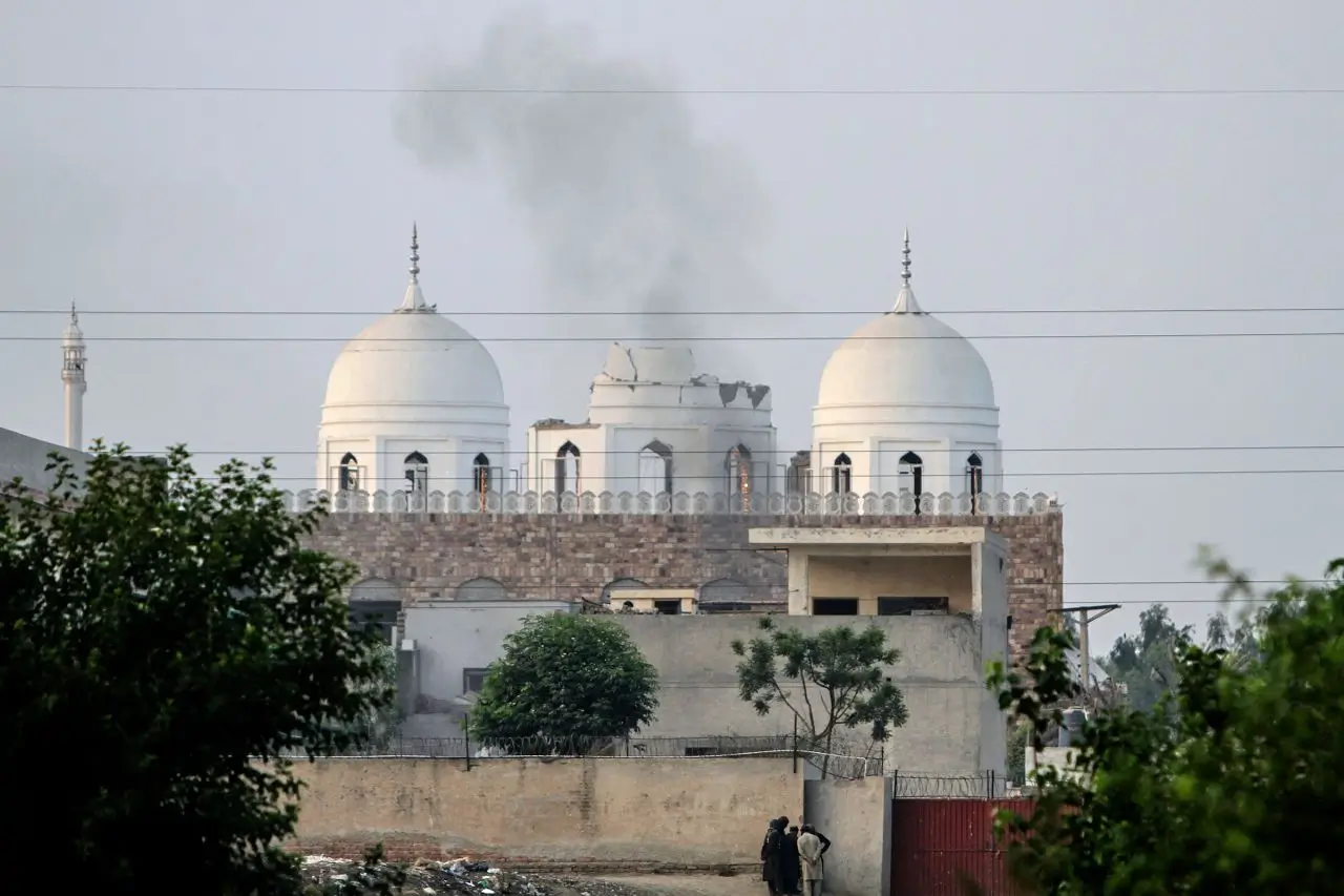 People outside a mosque damaged by an Indian missile strike, outskirts of Bahawalpur, Pakistan