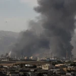 Massive black smoke rising from an industrial facility following a US-Israel air strike during the Iran Israel attack.